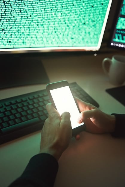 A smartphone displaying a two-factor authentication code, with a blurred computer screen in the background. The image focuses on the phone and the security code.