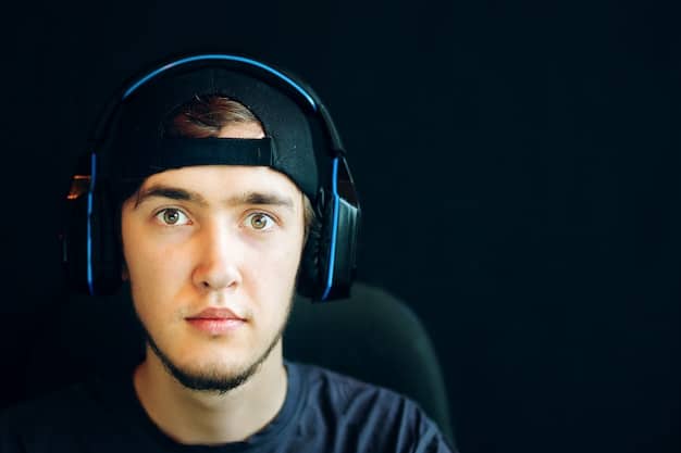 A close-up photo of a professional esports player with a determined expression, illuminated by the screen, during a high-stakes competition. The background features blurred visuals of the stadium and audience, emphasizing the intensity and pressure of esports tournaments.