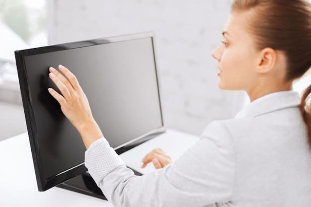 A side-view shot of a properly positioned monitor with the top edge at or slightly below eye level. The desk is clean and organized, and the lighting is soft and indirect, minimizing glare on the screen.
