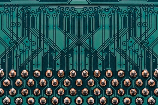 Close-up of a motherboard of a game console with intricate circuitry and various connection points visible. The image highlights the complexity of internal components.