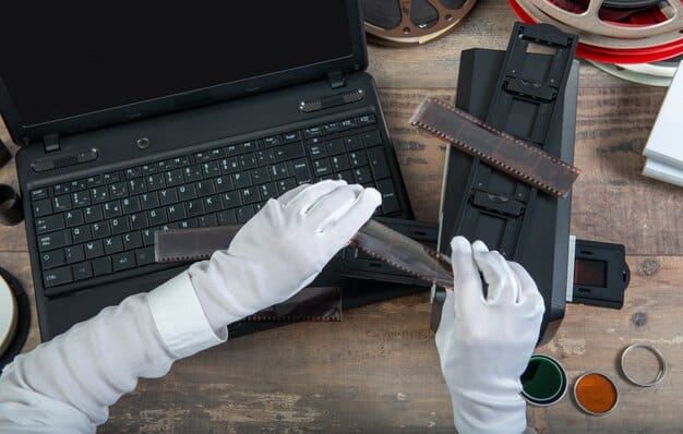 A person wearing an anti-static wrist strap working on the motherboard of an Xbox Series X console. The workspace is well-lit and organized, with various tools neatly arranged.