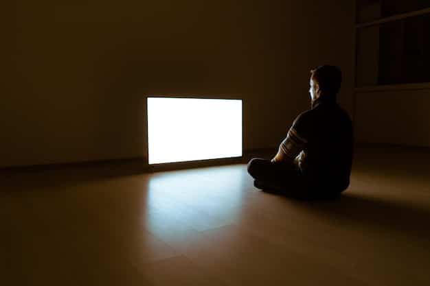 An individual sitting alone in a dark room, illuminated only by the light of a gaming console and neglecting a phone displaying missed calls and messages from friends. The scene conveys feelings of isolation and disconnect from the outside world due to excessive gaming.